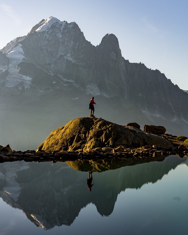 Alone on the rock, the Aiguille Verte mirrored