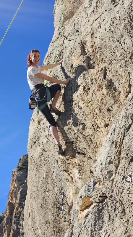Climber on the limestone wall at El Chorro